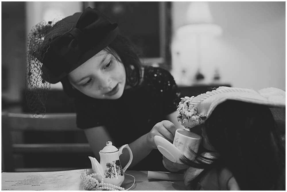 sharing a cup of tea with her american girl doll at teaberry's restuarant in flemington, nj.audrey blake PHOTOGRAPHY