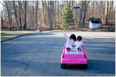 childhood Unplugged, Suburban life on a dead end street, ride on cars and kids, audrey blake photography. the art of play
