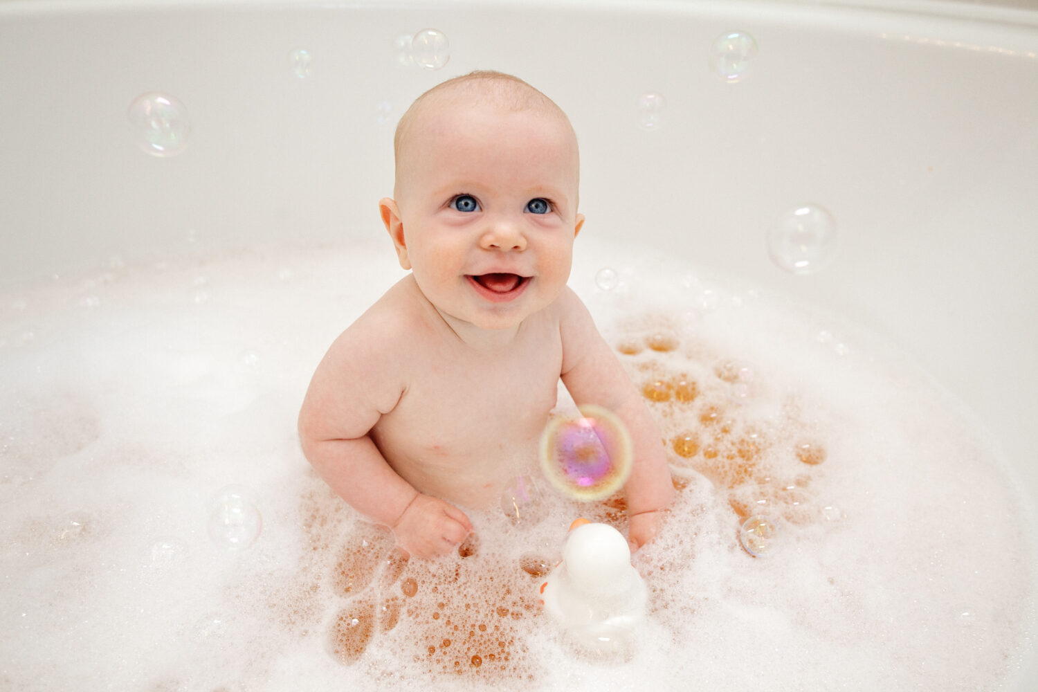 smiling baby in tub